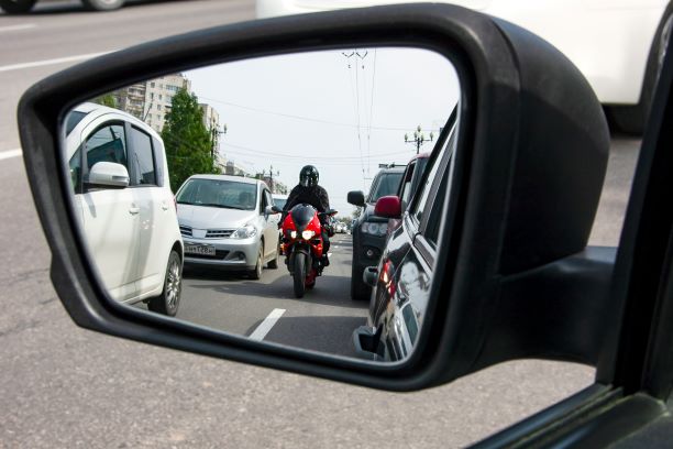 Motorist in a Rearview Mirror - Motorcycle Accident Lawyer