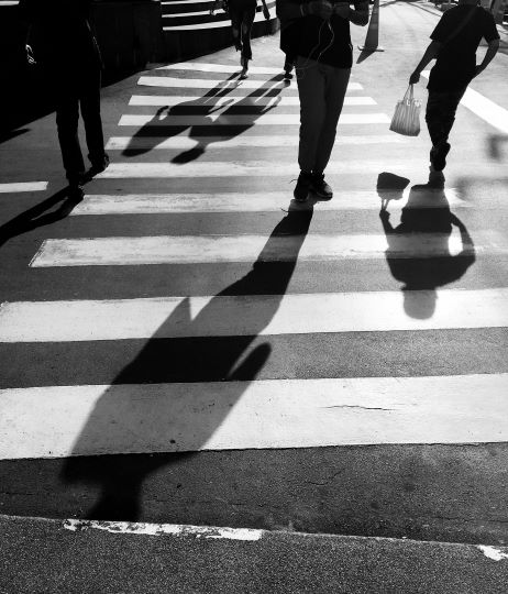 Pedestrians Walking Across Crosswalk