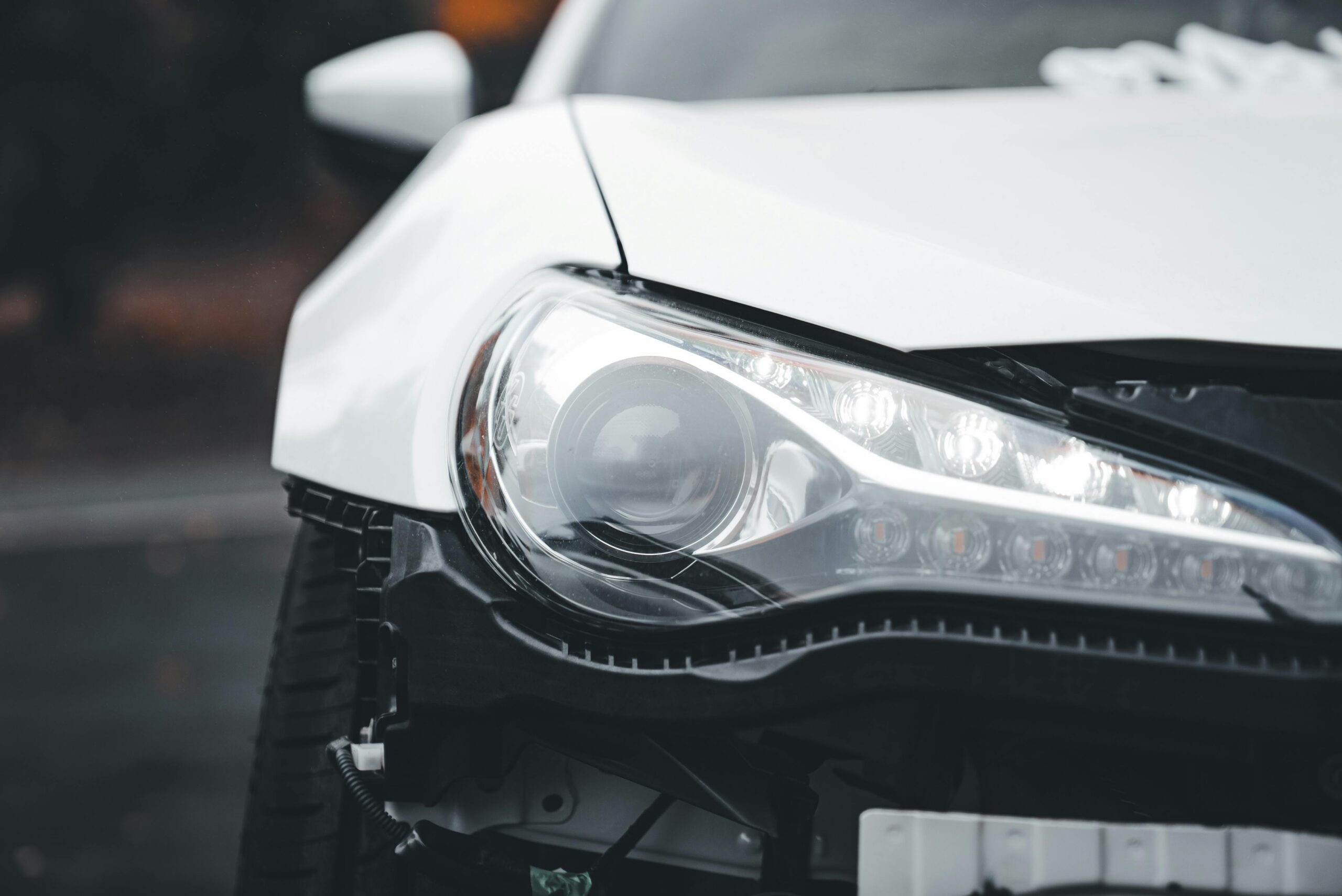 Front-end car damage with broken headlight after Minneapolis traffic accident